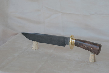 A damascus bowie knife on display