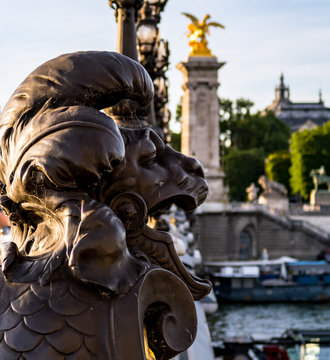View of Pont Alexandre lll bridge. Close-up on a statue - Paris, France.
