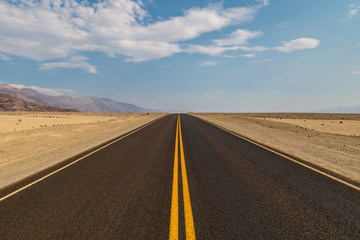 Fototapeta na wymiar A newly resurfaced road in Death Valley, California