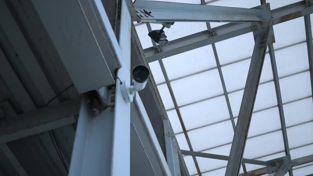 A camera watches a office building area - security concept 