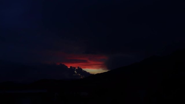 Timelapse of a beautiful, cloudy, golden sunset at a lake in the French Alps. Shot with the timelapse mode on a Canon 80D after a thunderstorm in July at Lake Serre Pon&ccedil;on, in southeast France.