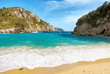 Fototapeta na wymiar Beautiful sandy beach in Paleokastritsa in Corfu island, Greece