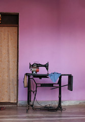 Sewing machine and table in front of the house