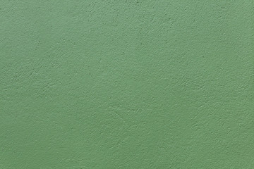 Green painted stucco wall.