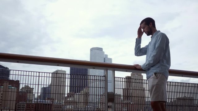 A man realizes he has head pain while downtown