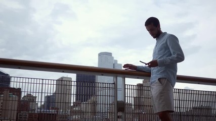 A man realizes that he is late and rushes off