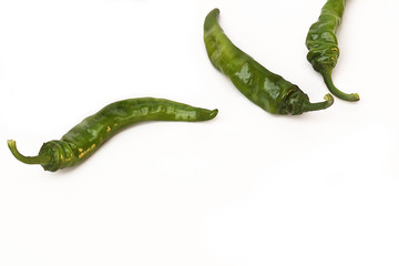 The bay leaf and green chili pepper or spices on a white background. Isolated. Used in cooking as a spice. Selective focus, top view, copy space, mockup.