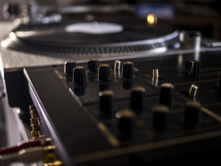 close up macro shot of dj music audio equipment knobs on the mixer