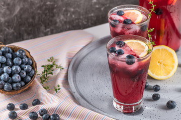 Fresh blueberry summer mojito cocktail. Blueberry lemonade or sangria on kitchen countertop.