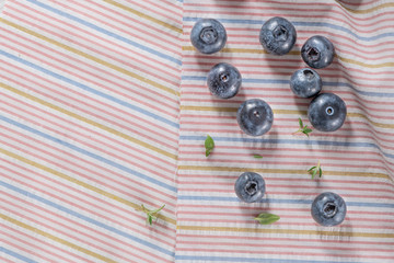 Wild blueberry in top view flat lay with copy space for background or wallpaper. Blueberry is antioxidant food and vitamin C. Healthy and delicious fruits concept of blueberry.