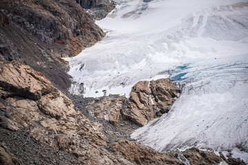 A view of the rocky surface with the glacier on it. Shevelev. - 216345900