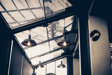 Fototapeta na wymiar Vintage lighting lamp in restaurant,Warm light toned