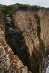 Watefalls gently flowing down to the beach