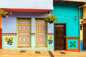 Fototapeta na wymiar Colorful colonial houses on a street in Guatape, Antioquia in Colombia.