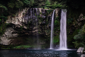 Fototapeta na wymiar Cheonjiyeon Waterfall in Jeju Island, South Korea