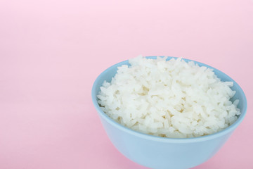 rice in bowl on pink background rose quartz