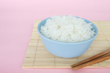 rice in bowl on pink background rose quartz