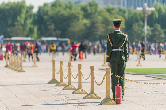 Soldier stands guard near the entrance to Forbidden City in Tiananmen Square.