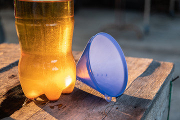Hand is pouring the used oil