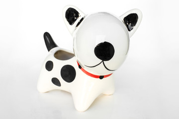 Naklejka premium dog statue ceramic on white background