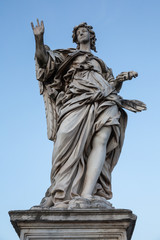Fototapeta na wymiar Angel with the nails by Girolamo Lucenti on the Pont Sant'Angelo bridge in Rome