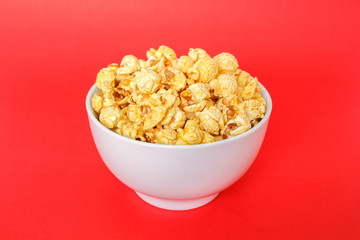 popcorn white bowl on red background