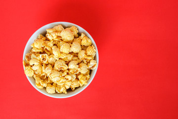 popcorn white bowl on red background