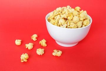 popcorn white bowl on red background