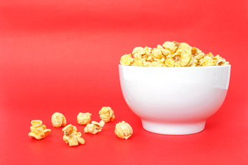 popcorn white bowl on red background
