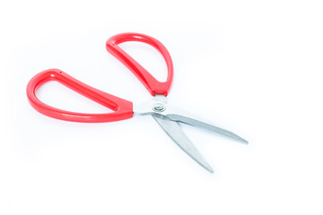 red scissors cutting on white background