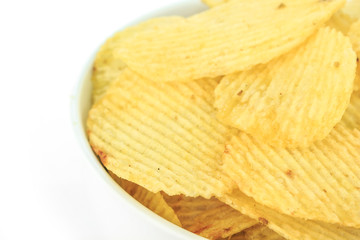 crispy potato chips junk food unhealthy food on bowl white background