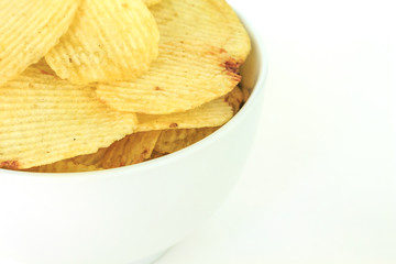 crispy potato chips junk food unhealthy food on bowl white background