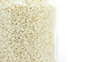 white sesame seed in jar on white background