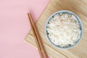 rice in bowl on pink background rose quartz