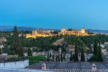 Fototapeta premium The magnificient Alhambra of Granada, Spain. Alhambra fortress at sunset viewed from Mirador de San Nicolas.