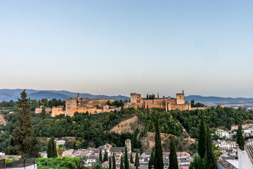 Fototapeta na wymiar The magnificient Alhambra of Granada, Spain. Alhambra fortress at sunset viewed from Mirador de San Nicolas.