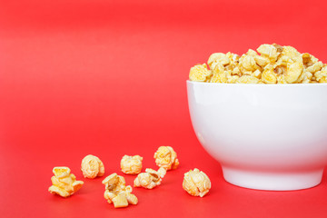 popcorn white bowl on red background