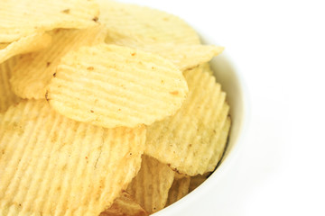 crispy potato chips junk food unhealthy food on bowl white background