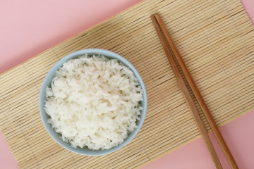 rice in bowl on pink background rose quartz