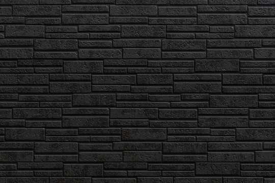 Black modern stone tile wall pattern and seamless background