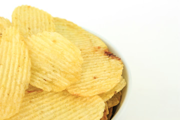 crispy potato chips junk food unhealthy food on bowl white background