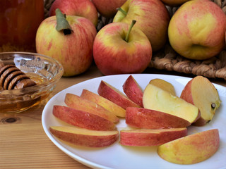 Apple slices with honey, sweet fruit dessert, autumn still life.