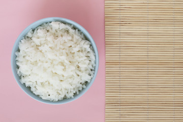 rice in bowl on pink background rose quartz