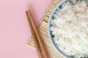 rice in bowl on pink background rose quartz