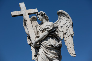 Angel with the cross sculpture by Ercole Ferrata on the Pont Sant'Angelo bridge in Rome