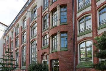 Fototapeta na wymiar Facade of a modernized residential house with red bricks