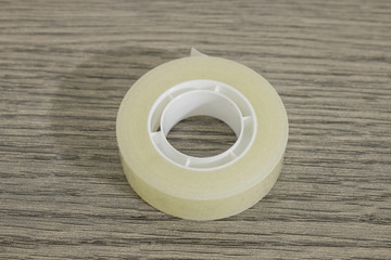 Stationery, transparent scotch tape on a wood table