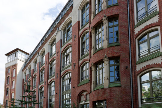 Facade of a modernized residential house with red bricks © kelifamily