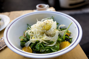 Fennel, olive, rocket and orange salad with fresh bruschetta and a short black coffee in Rome, Italy