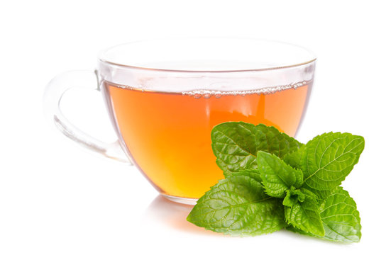 Glass cup of Tea with mint leaves   isolated on white background